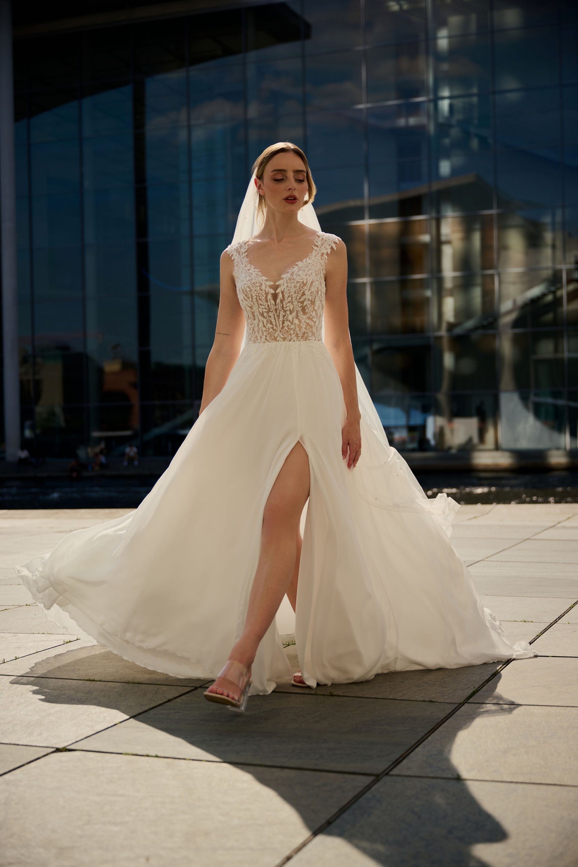 Talarena wedding dress by Lina Becker Germany, Deep V-neckline with sheer illusion detailing