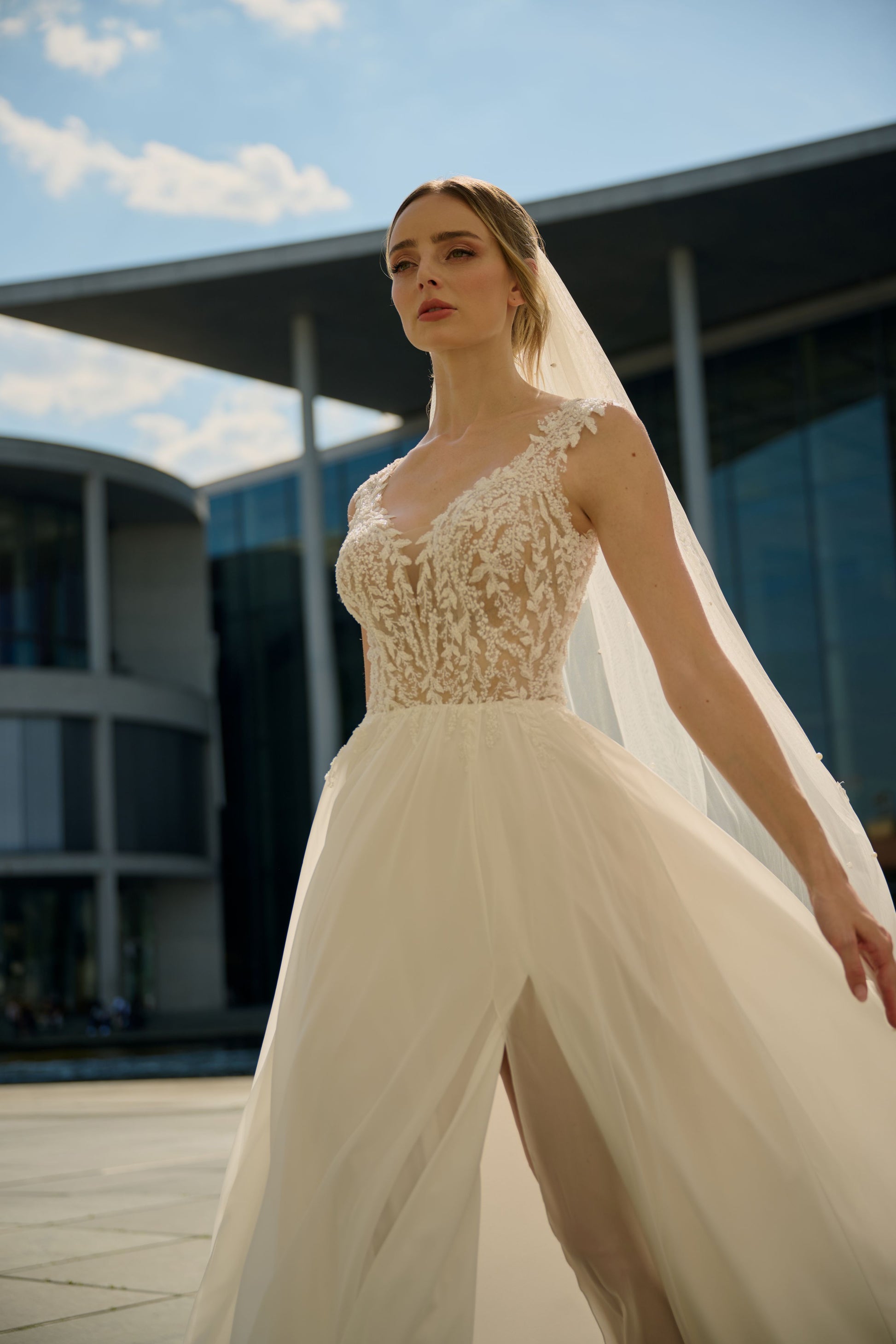 Talarena wedding dress by Lina Becker Germany, Delicate lace appliqués, softly flowing chiffon, subtle transparency